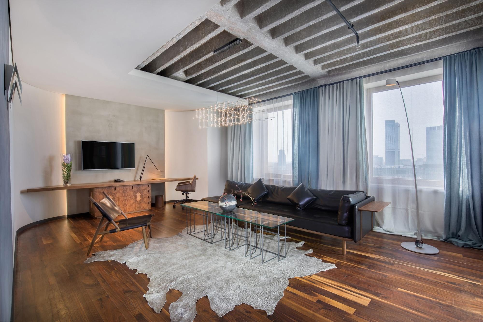 Hotel Warszawa Exterior photo A living room with a cowhide rug
